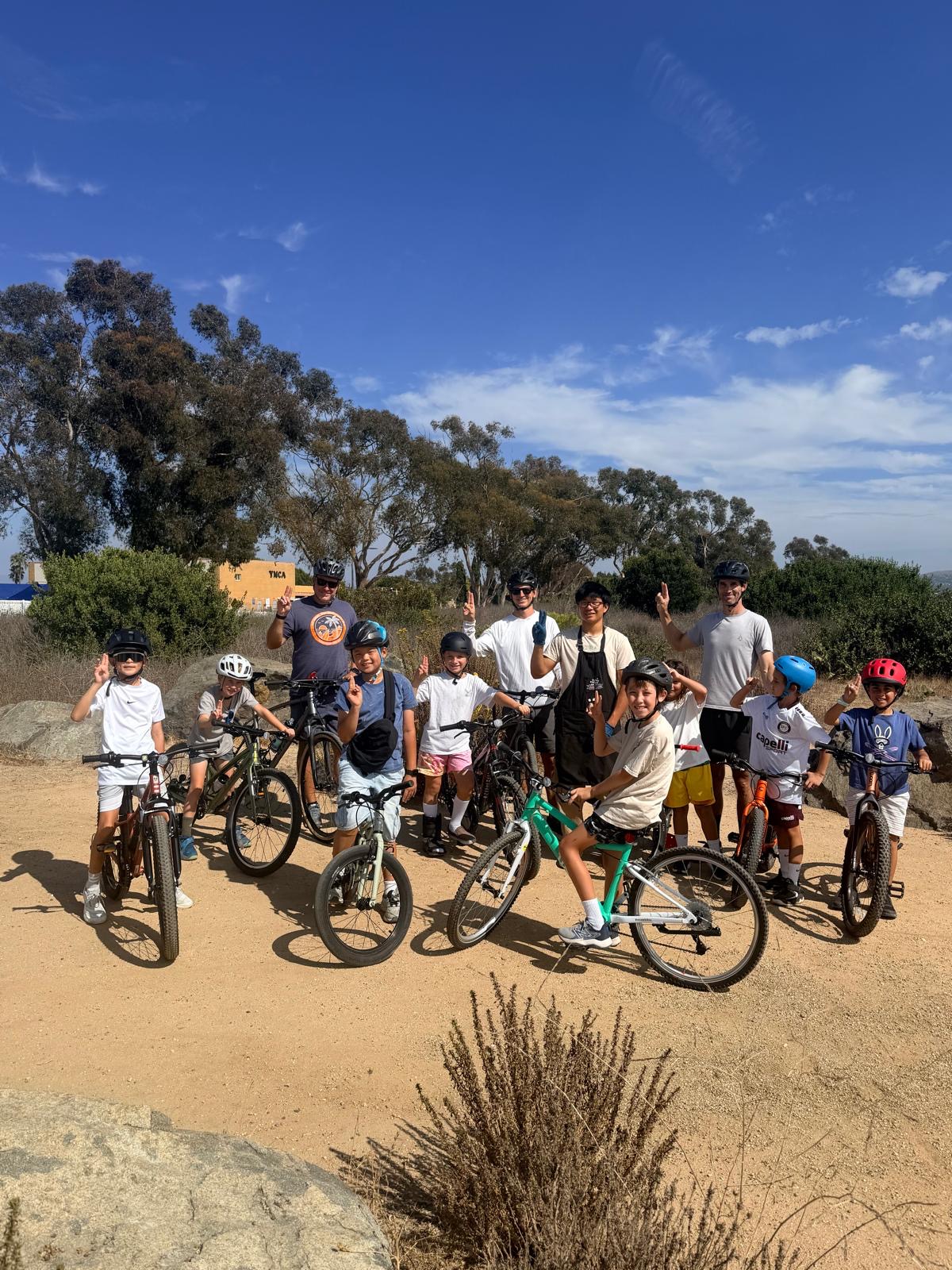 Cub Scouts and dads posing with their bikes before the Back Bay ride