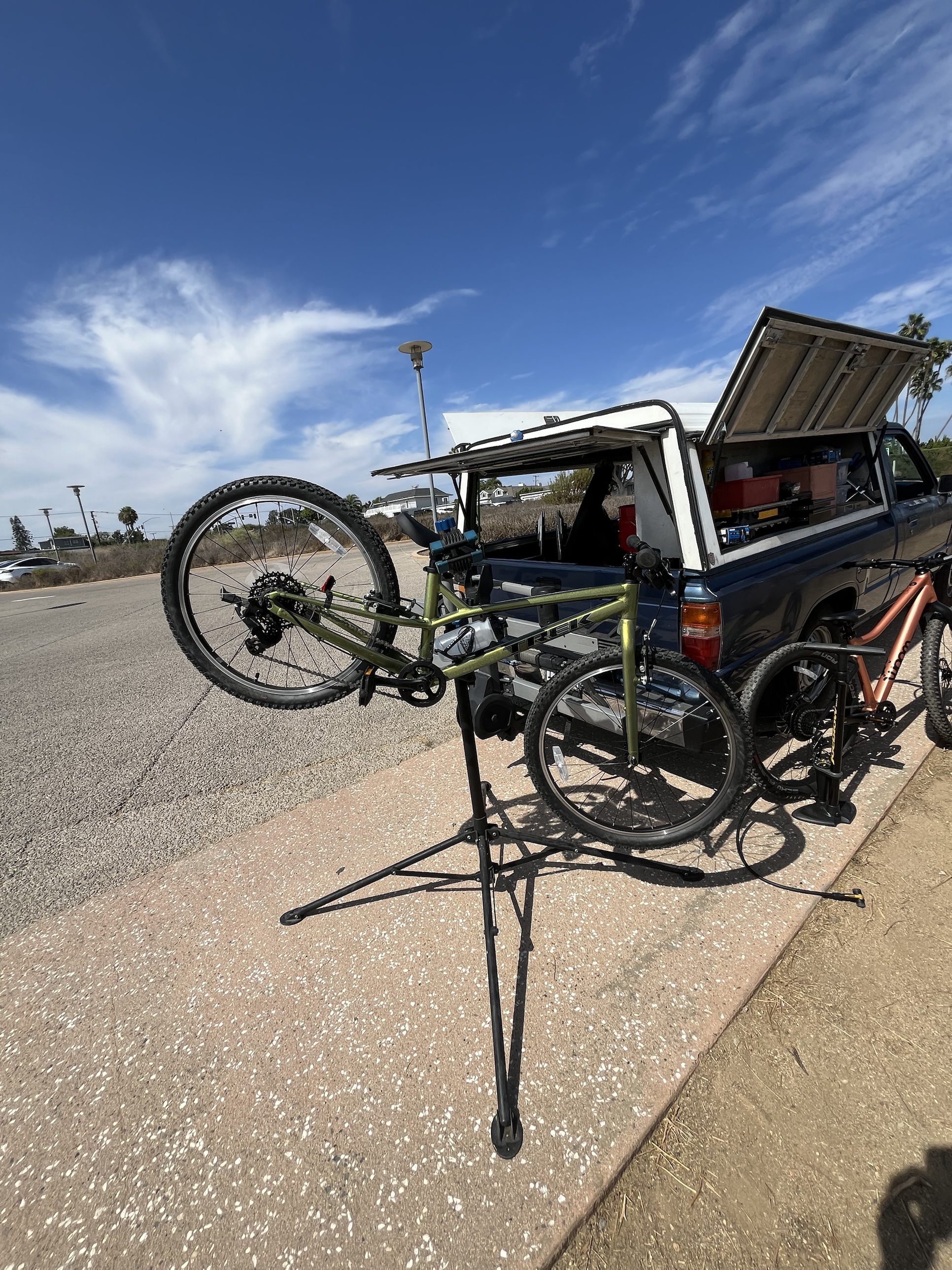 Adjusting a Trek bike on the repair stand at the Back Bay trailhead